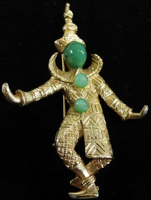 Brooch. Dancer brooch with Jade color beads in a gold tone inlay