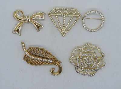 5 Gold Tone With Rhinestones Broaches. gold tone and rhinestone pins, different shapes 