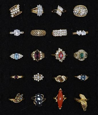 20 Gold Tone Rings. different sizes of rings, gold tone with different faux gems