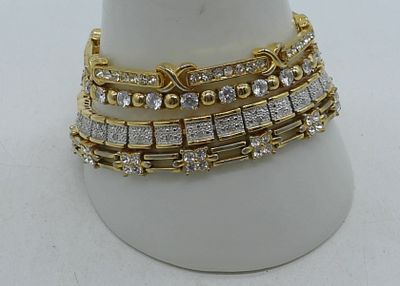 4 Gold Tone Bracelets. 7 1/2", 7", 8", and 8 1/2", gold tone with faux stones