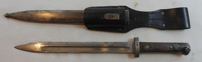 WWII German Bayonet With Scabbard. German bayonet with scabbard and leather holder, leather is 