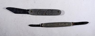 The Coca-Cola Bottling Co. Knife. Coca-Cola U.S.A. Knife. Both pre-owned.