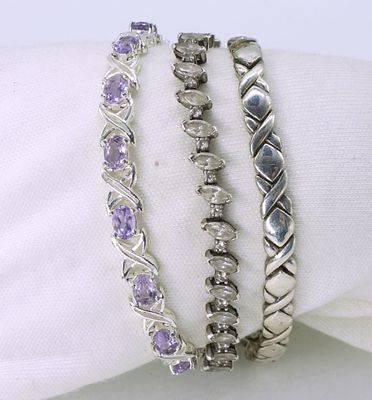 3 Sterling Fashion Bracelets - Amethyst. Three sterling bracelets. Amethyst, simulated diamond 
