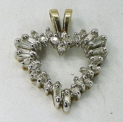 10k Yellow Gold Diamond Heart Pendant. 10k yellow gold diamond heart pendant with round and 