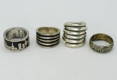 Four Sterling Rings - Bands. Four sterling rings, sizes 8, 9, 10. Etched floral, city scape and 