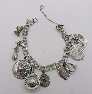 Vintage Sterling Charm Bracelet - 9 Charms. Vintage sterling charm bracelet, 7" with 9 charms. 