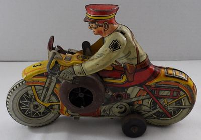 Louis Marx Tin Litho Motorcycle Toy. Decent condition, does not move after windup, missing 
