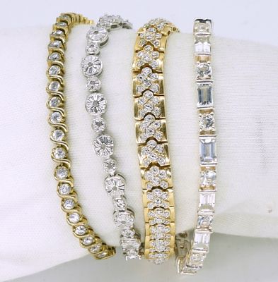 Four Sterling & Gold Tone Tennis Bracelets. Four sterling bracelets, simulated diamonds. Gold 