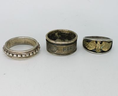3 Men's Sterling Rings - 1 Harley Davidson. Three sterling men's rings, one is Harley Davidson. 