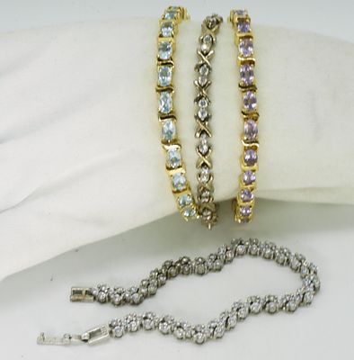 4 Sterling & Gold Tone Tennis Bracelets. Four sterling bracelets, some gold toned. One is 