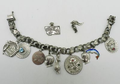Late 1970's Sterling Charm Bracelet. Late 1970's sterling charm bracelet, 11 charms. 7" long. 