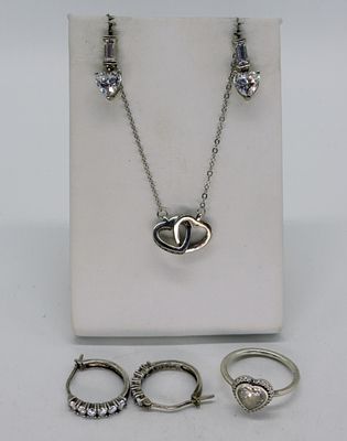 Simulated Diamond Heart Set. Simulated diamonds, necklace 18" long. Two pair of pierced 