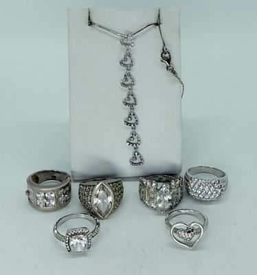 7 Sterling Simulated Diamond Rings & More. Six sterling rings with simulated diamond gemstones. 