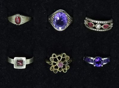 6 Amethyst & Garnet Sterling Rings. Six sterling rings with amethyst and garnet gemstones. Sizes 