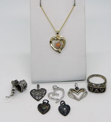 8 Pieces of Sterling Heart Shaped Jewelry. Six loose sterling heart shaped pendants. Gold tone 