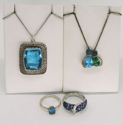 Two Sterling Necklaces & Rings - Blue Topaz. Two sterling necklaces, with blue topaz and other 
