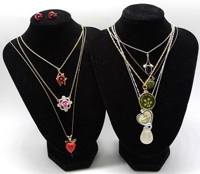 (8) Necklaces (1) Pair of Earrings. vintageauctionsonline.com