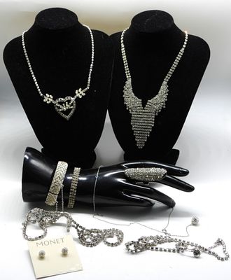 Clear Rhinestones. (5) Necklaces (2) Bracelets (1) Ring sized:6.5 & (1) Pair of post earrings