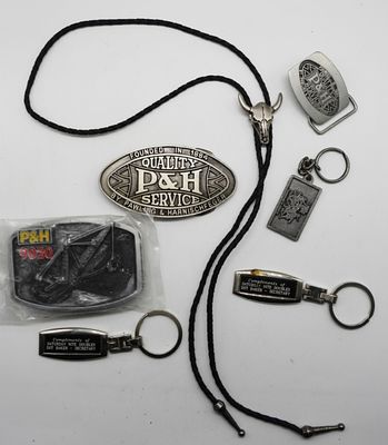 Key Chains & Belt Buckles & Bolo Tie. (3) Key Chains, (3) P&H Belt buckles, (1) Bolo Tie