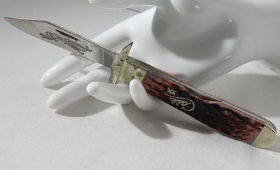 Case XX 6111 1/2L SS Cheetah Cranberry Knife. Visit us at live.vintageauctionsonline.com