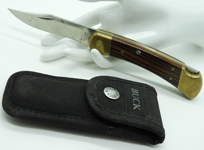 Buck 110 Lock-Back Pocket Knife. Like new. Comes with a nylon sheath