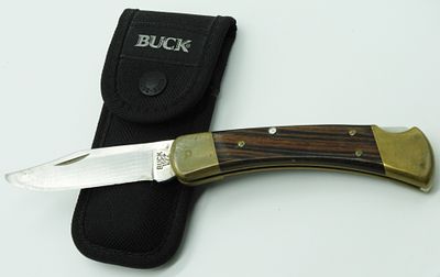 Buck 110 Lock-Back Pocket Knife. Used. Comes with a nylon sheath
