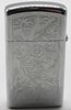 1975 Zippo Slim Venetian Pattern Unfired. Unfired. The engraved spot is engraved with "E A". Image - 1