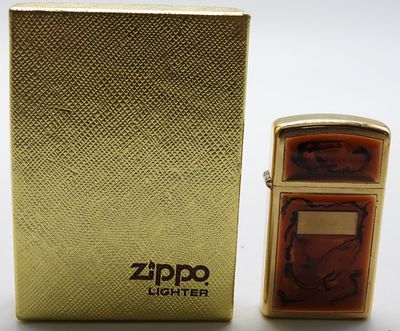 1977 Tortoise Slim Zippo Lighter Unfired. Comes in its original box. Unfired. Does have an 