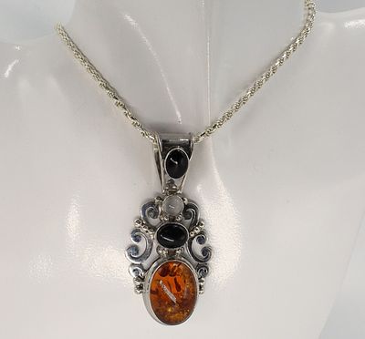 Amber & Black Onyx Sterling Necklace. Amber and Black Onyx sterling silver pendant on a 18" 