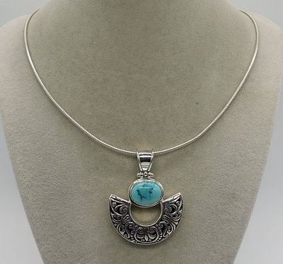Sterling Turquoise Pendant Necklace. Sterling and Turquoise pendant (marked 925), 2" long. 18" 