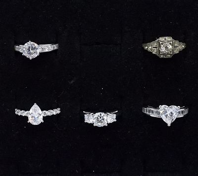 5 Sterling Simulated Diamond Rings. Five sterling simulated diamond rings, sizes 6, 7, 9. (9 dwt)
