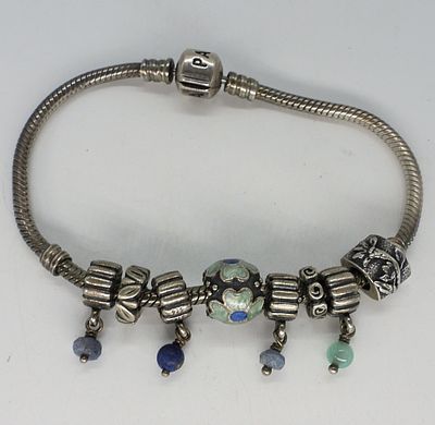 Pandora Charm Bracelet & Charms. Sterling pandora charm bracelet, 7" with 8 sterling charms. (17 dwt)