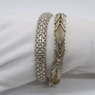 Two Sterling Bracelets. Two sterling fashion bracelets, 7" and 7.5". (23.4 dwt)