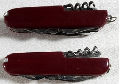 Multi-Tool Swiss Army Style Knives, Red Scales. Two multi-function folding knives with red 