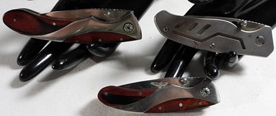 Appalachian Trail Folding Knives, Red Wood Handles. Collection of modern tactical folding knives 