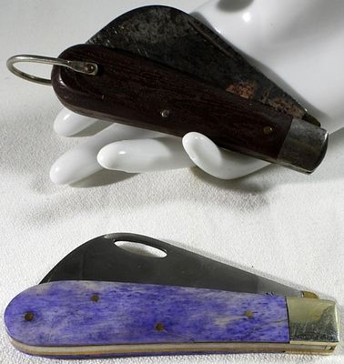 Vintage Folding Knives, Purple & Dark Handles. Two vintage folding knives featuring contrasting 