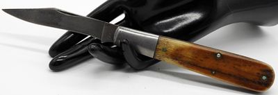 Case XX Folding Knife. This Case XX folding knife features classic wood handle scales with brass 