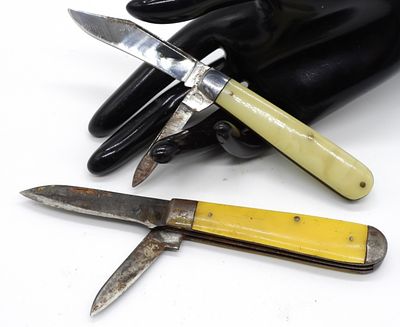 Vintage Folding Knives, Yellow Handle Lot. Two vintage folding pocket knives featuring yellow 