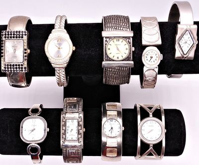 Lot of 10 Silver Tone Cuff Watches, Mixed Styles. A collection of ten silver tone cuff style 