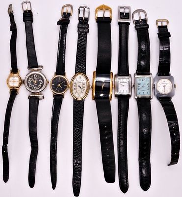 Lot of 8 Vintage Leather Band Watches. A collection of eight vintage wristwatches in gold tone 