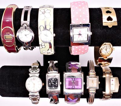 Lot of 12 Fashion Watches. A collection of twelve wrist and cuff style watches spanning multiple 