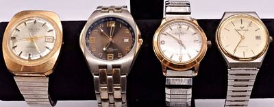 Four Men's Watches. A collection of four vintage men's wristwatches. The lot includes two 