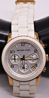 Michael Kors Chronograph. Michael Kors women's chronograph with a two-tone design pairing white 