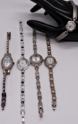 Lot of 5 Dainty Women's Clasp Watches. Collection of five petite women's clasp watches in silver 