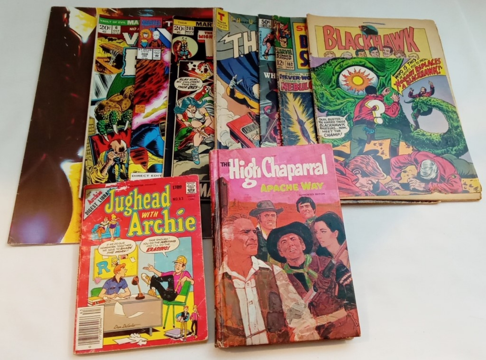 A Mix Of Books, Comics & Poster