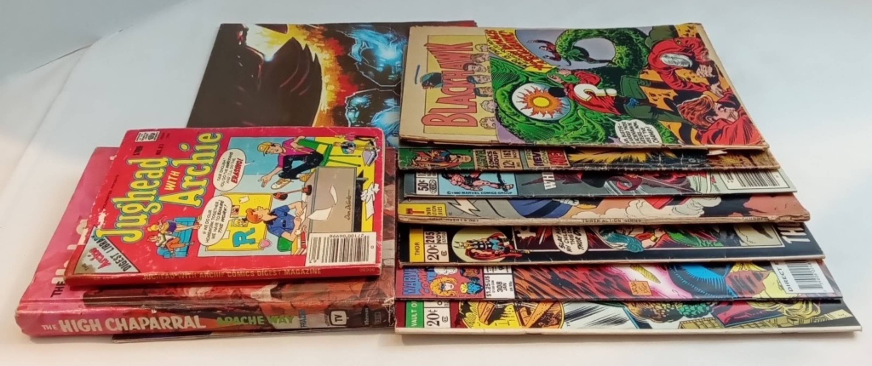 A Mix Of Books, Comics & Poster