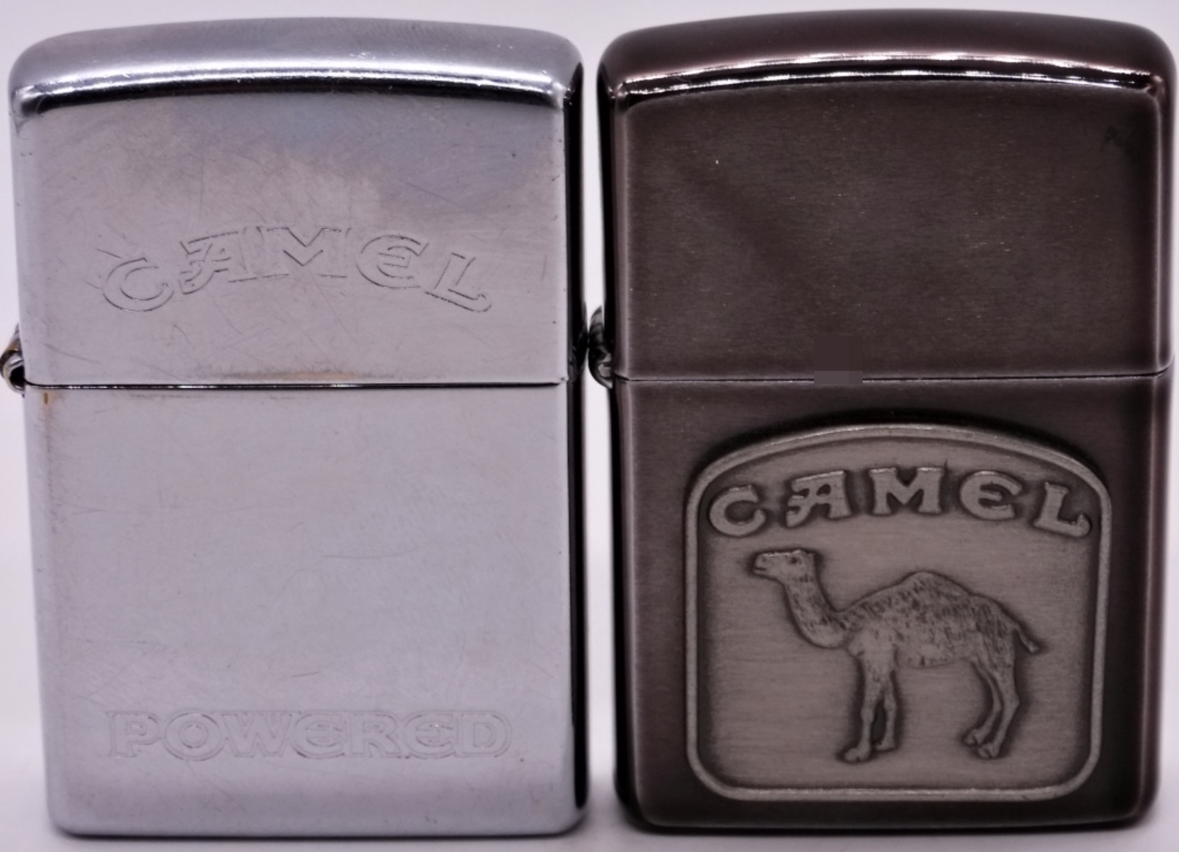 Two Camel Zippo Lighters, 1992 and 1997
