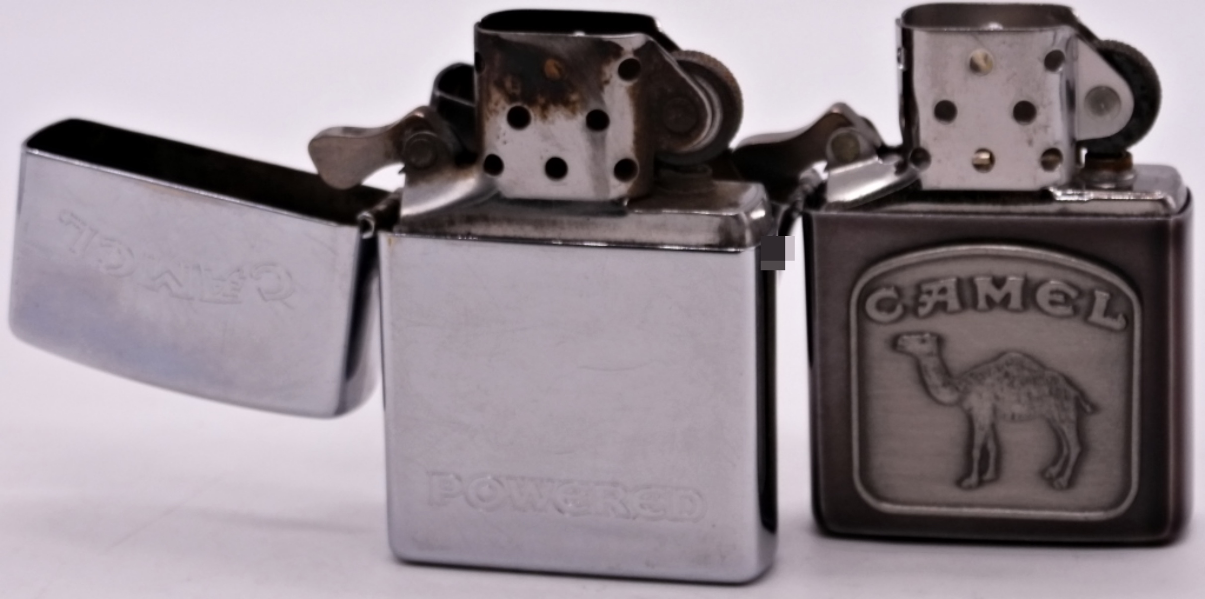 Two Camel Zippo Lighters, 1992 and 1997