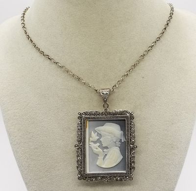 Sterling Marcasite Cameo Necklace. Features an ornate rectangular pendant with intricate 