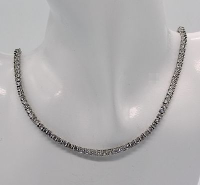 Sterling Silver Tennis Necklace. Marked 925 sterling silver tennis necklace measuring 24 inches 